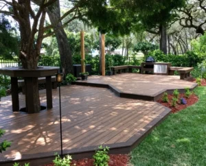Low irregular floating wood deck built around a mature backyard tree