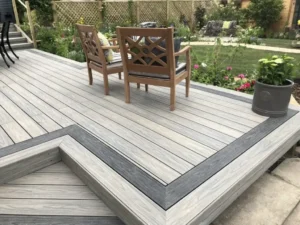 Weathered gray floating deck with a picture-frame border and dining furniture